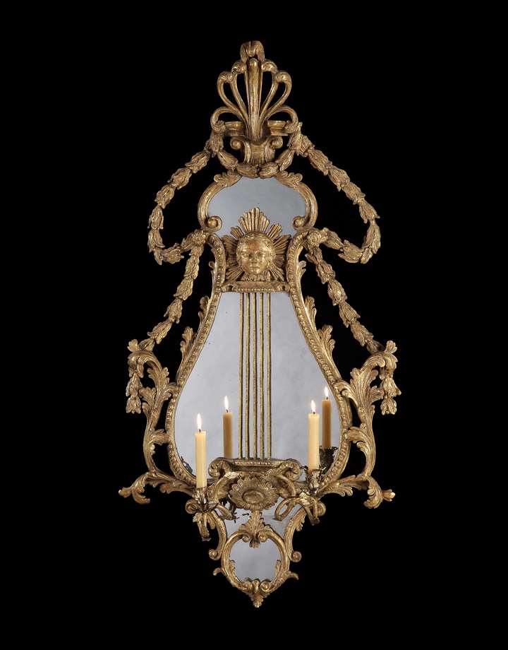 A pair of George III giltwood and composition girandoles